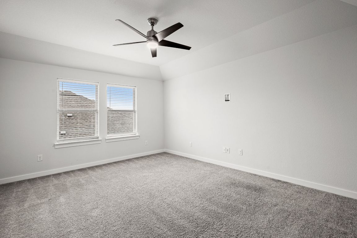 841 Spinnaker Loop Kyle, TX 78640 - Photo 27 of 40 an empty room with a window and a fan