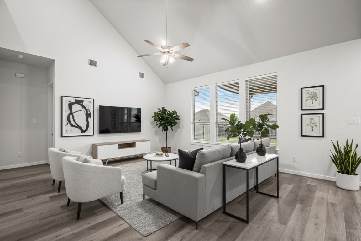 841 Spinnaker Loop Kyle, TX 78640 - Photo 3 of 40 a living room with furniture and a flat screen tv