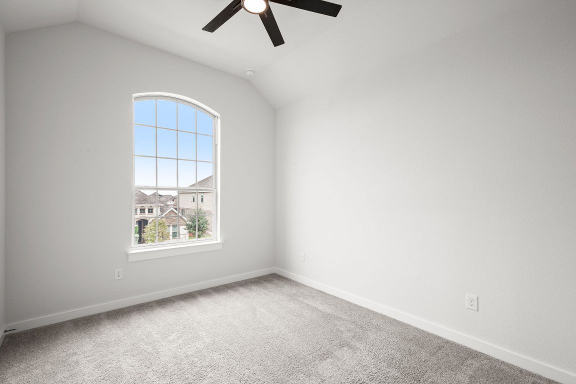 841 Spinnaker Loop Kyle, TX 78640 - Photo 35 of 40 an empty room with windows and fan