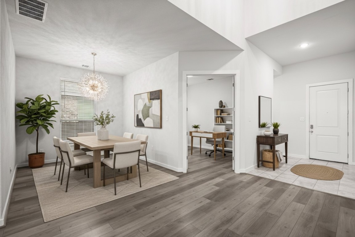 841 Spinnaker Loop Kyle, TX 78640 - Photo 4 of 40 a view of a dining room with furniture and wooden floor