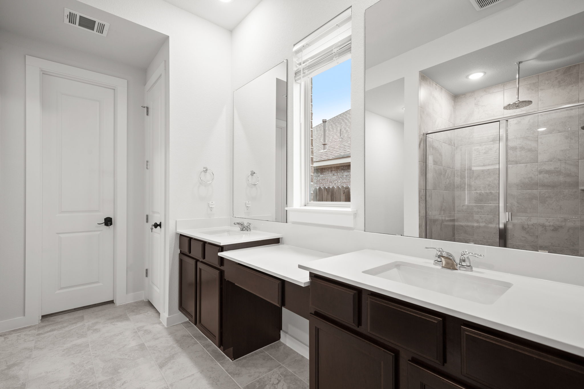 841 Spinnaker Loop Kyle, TX 78640 - Photo 4 of 40 Bathroom with a stall shower and double vanity