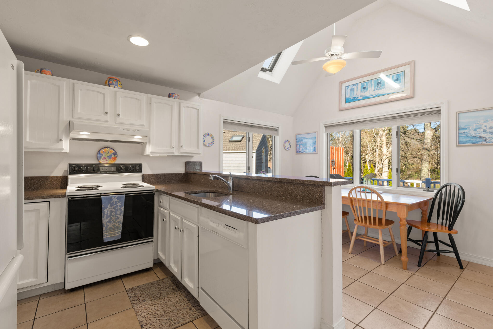 103 Summersea Road Mashpee, MA 02649 - Photo 11 of 41 a kitchen with granite countertop white cabinets and white appliances