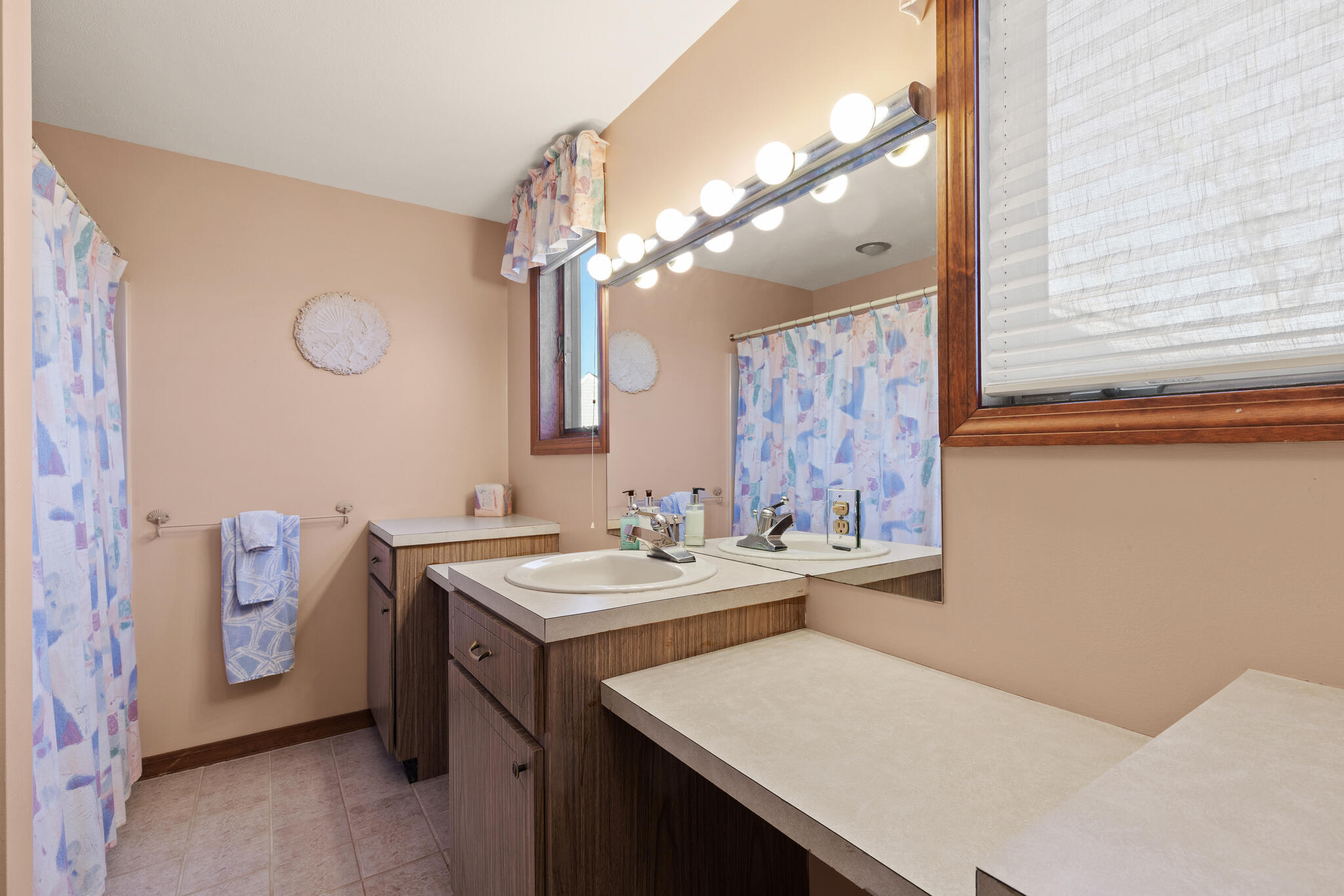103 Summersea Road Mashpee, MA 02649 - Photo 26 of 41 a bathroom with a sink a vanity and a mirror