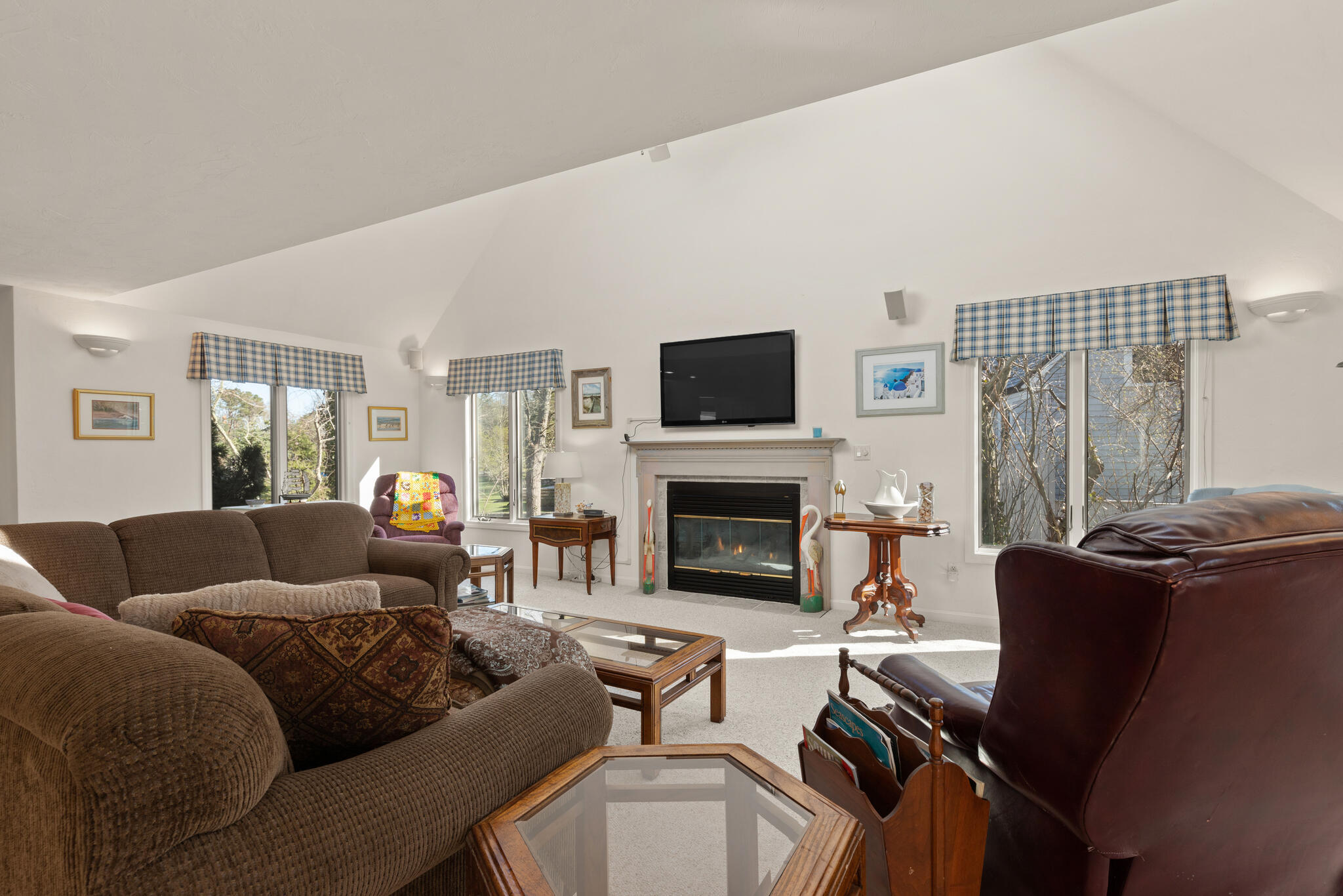 103 Summersea Road Mashpee, MA 02649 - Photo 8 of 41 a living room with furniture a fireplace and a flat screen tv