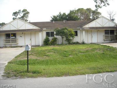7484 Garry Road Fort Myers, FL 33967 - Photo 1 of 3 a front view of a house with a yard