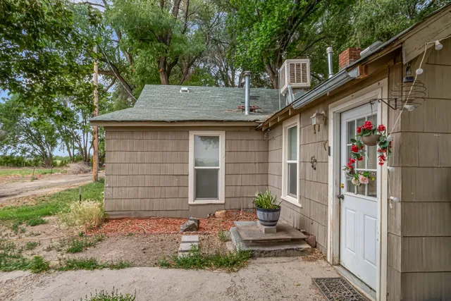 a view of a house with yard and a garden