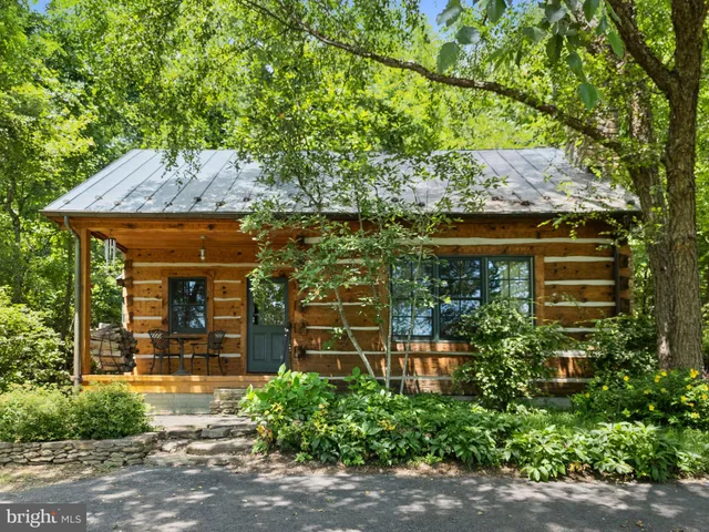 a view of a kitchen with table and chairs