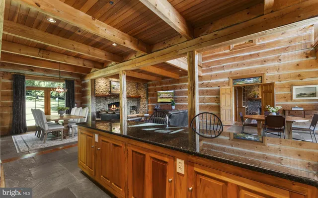 a view of a patio with table and chairs