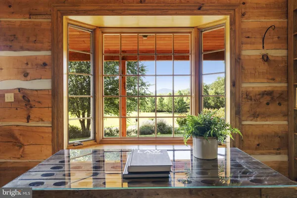 a bathroom with a granite countertop sink and a large mirror