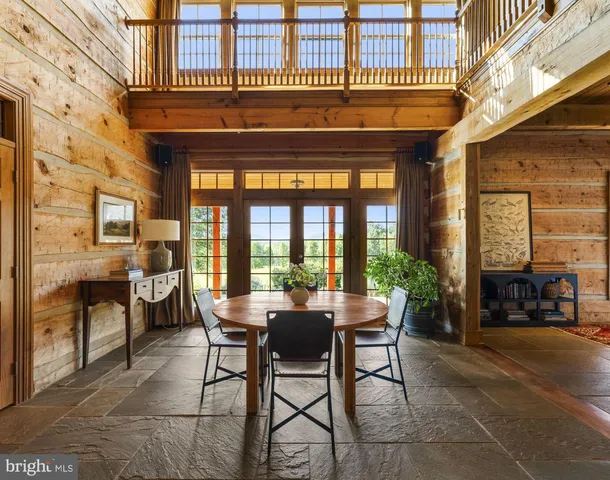 a view of a patio with a table and chairs