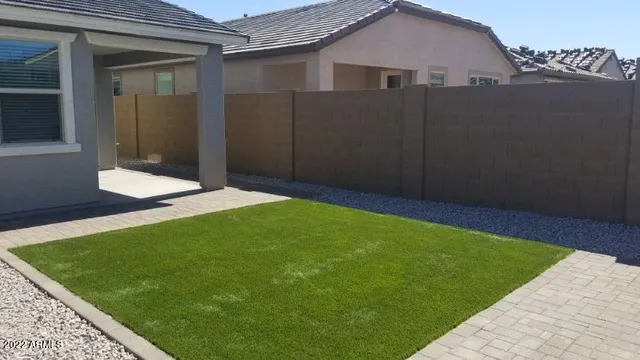 a backyard of a house with lots of green space
