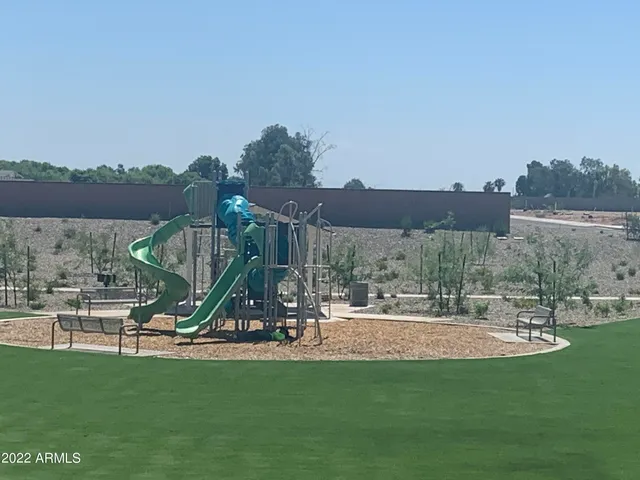 a view of a park with a slide