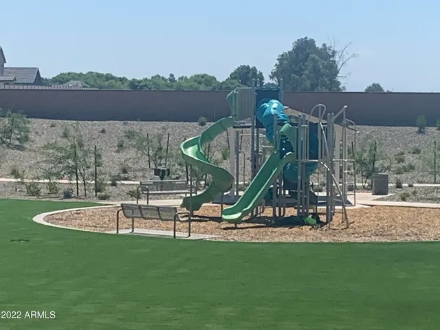 a view of a park with a slide