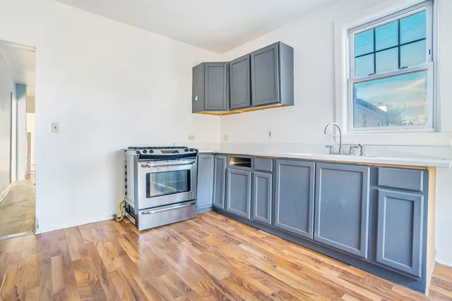 a kitchen with a stove and a sink