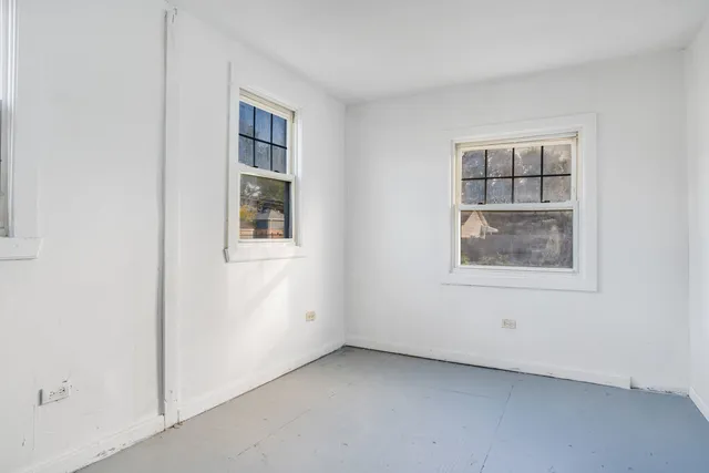 an empty room with windows