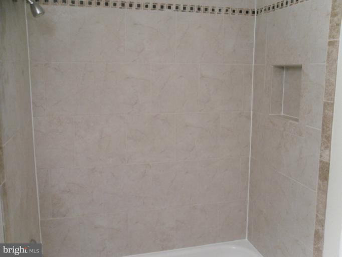 9349 Taney Road Manassas, VA 20110 - Photo 8 of 19 Custom tile shampoo nook in new full bath.