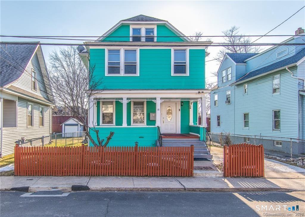 18 Lawrence Street Norwalk, CT 06854 - Photo 1 of 31 a front view of a house with a yard