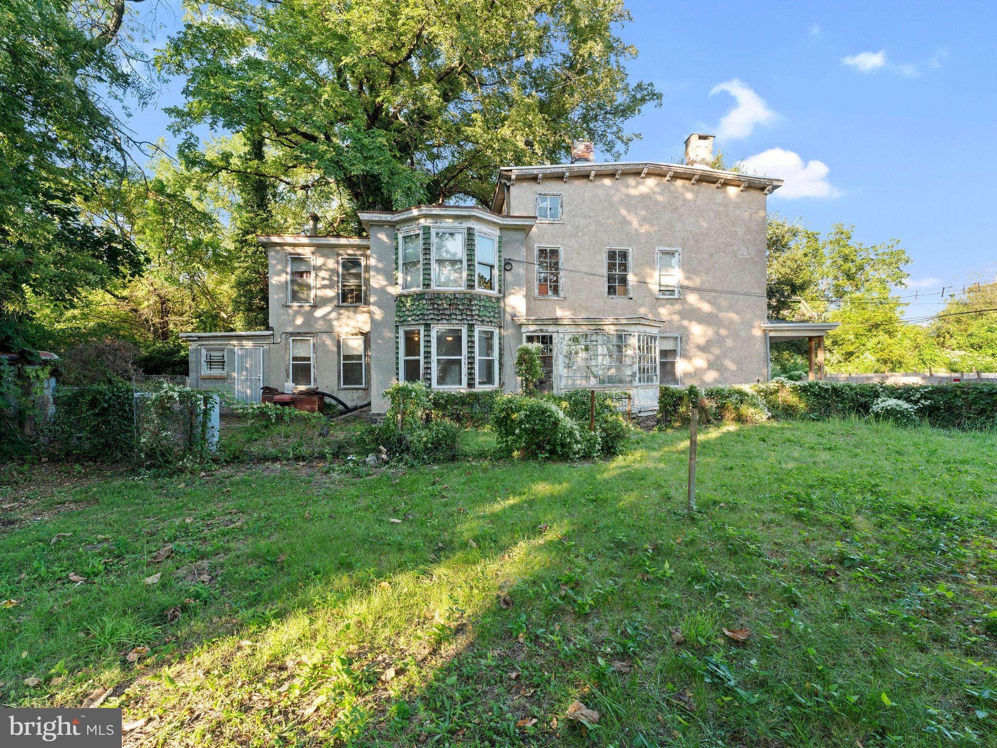 149 Herman Street Philadelphia, PA 19144 - Photo 1 of 35 a view of a big yard with plants and large trees