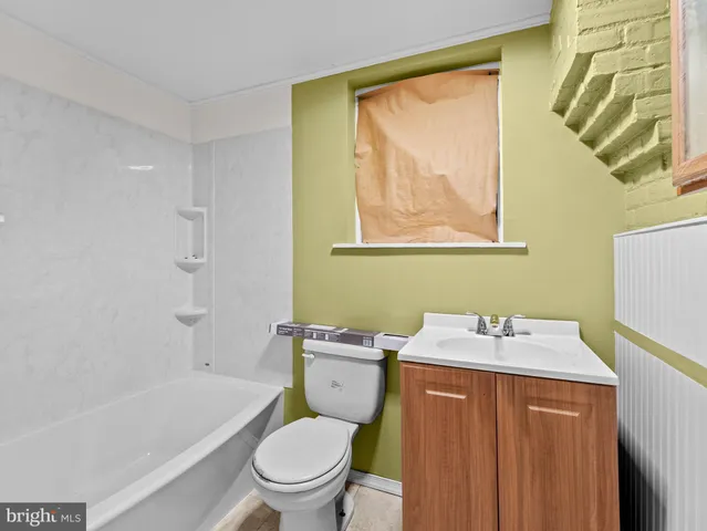 a bathroom with a sink toilet and vanity