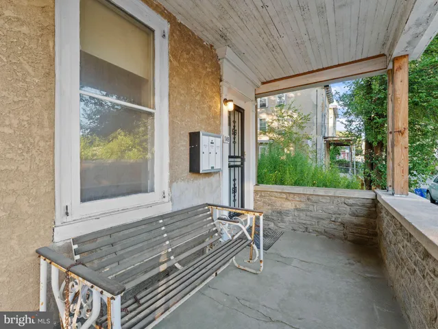 a view of house with a large window and wooden floor