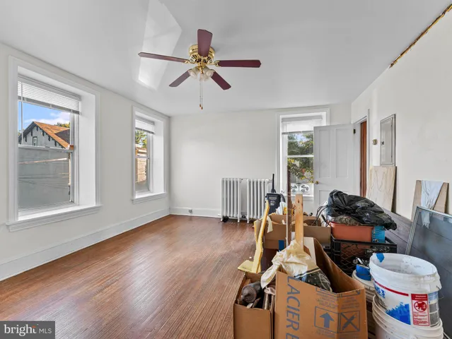 a room with furniture and wooden floor