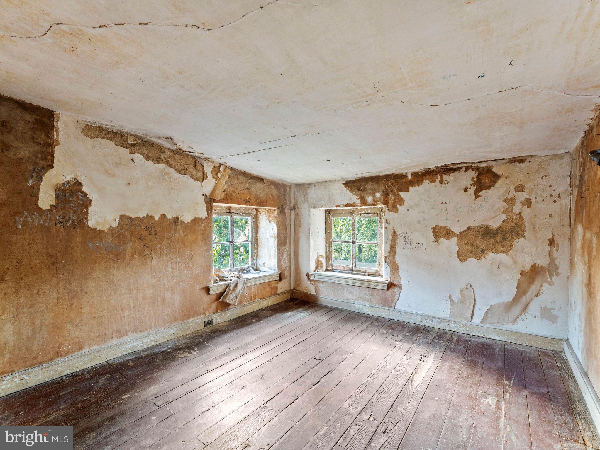 149 Herman Street Philadelphia, PA 19144 - Photo 33 of 35 wooden floor in an empty room with a window