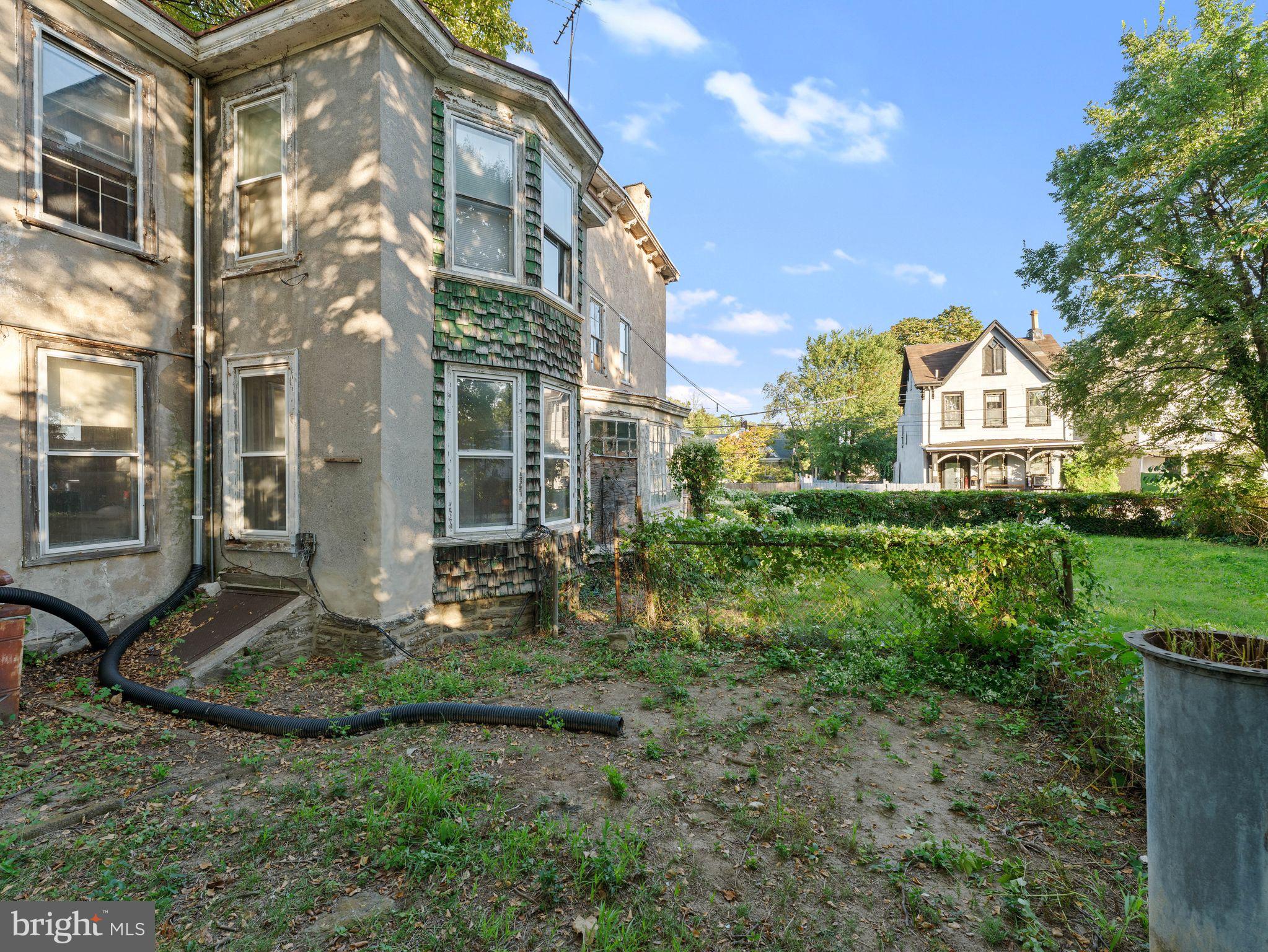 149 Herman Street Philadelphia, PA 19144 - Photo 6 of 35 a view of a large brick building next to a yard