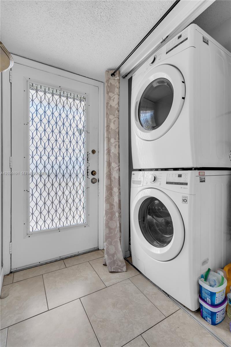 3551 Inverrary Drive, Unit 208 Lauderhill, FL 33319 - Photo 16 of 34 a view of a storage & utility room with washer and dryer