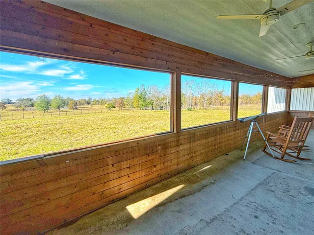 a view of an outdoor sitting area with porch