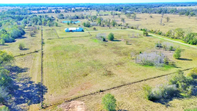 a view of a swimming pool with a yard