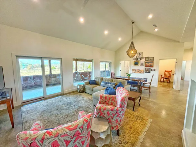 a living room with furniture and a table