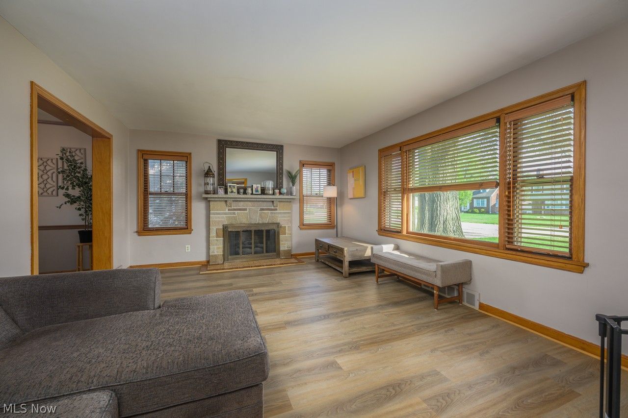 4361 22nd Street Northwest Canton, OH 44708 - Photo 5 of 31 Living room with large picture window and sandstone gas fireplace