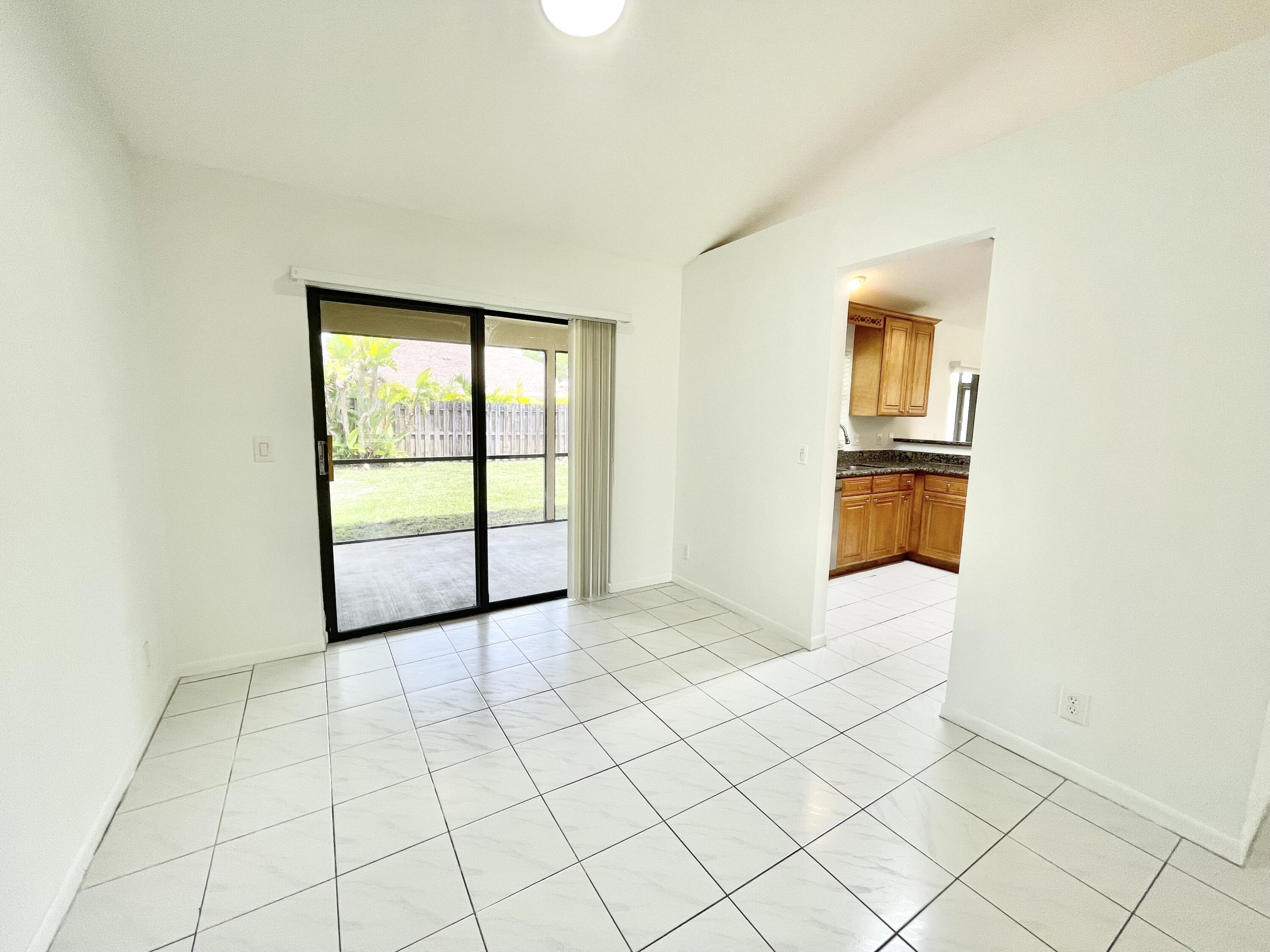 22550 Grouper Court Boca Raton, FL 33428 - Photo 13 of 20 Dining Room with Slider out to Patio