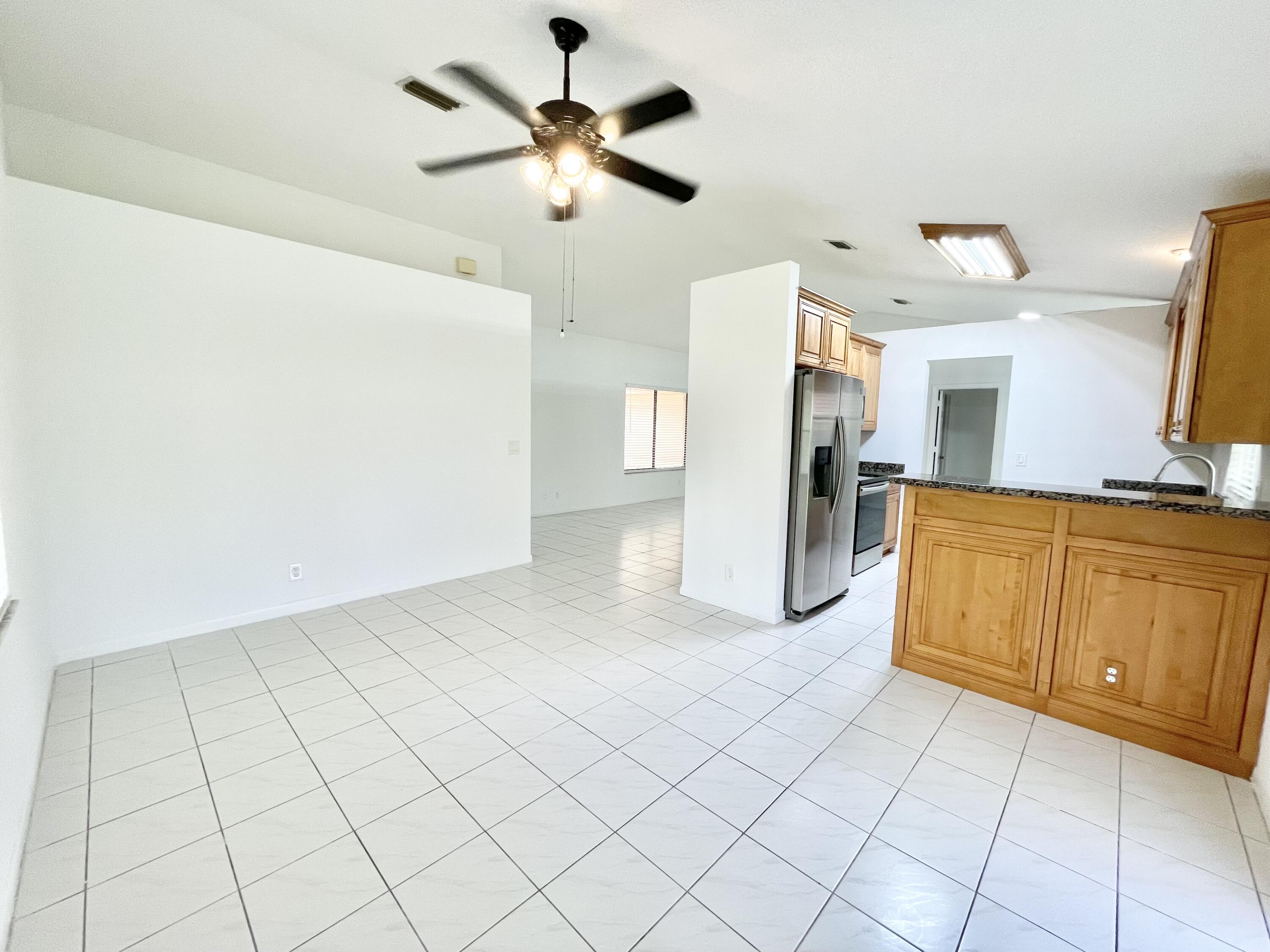22550 Grouper Court Boca Raton, FL 33428 - Photo 5 of 20 Kitchen Open to Family Room