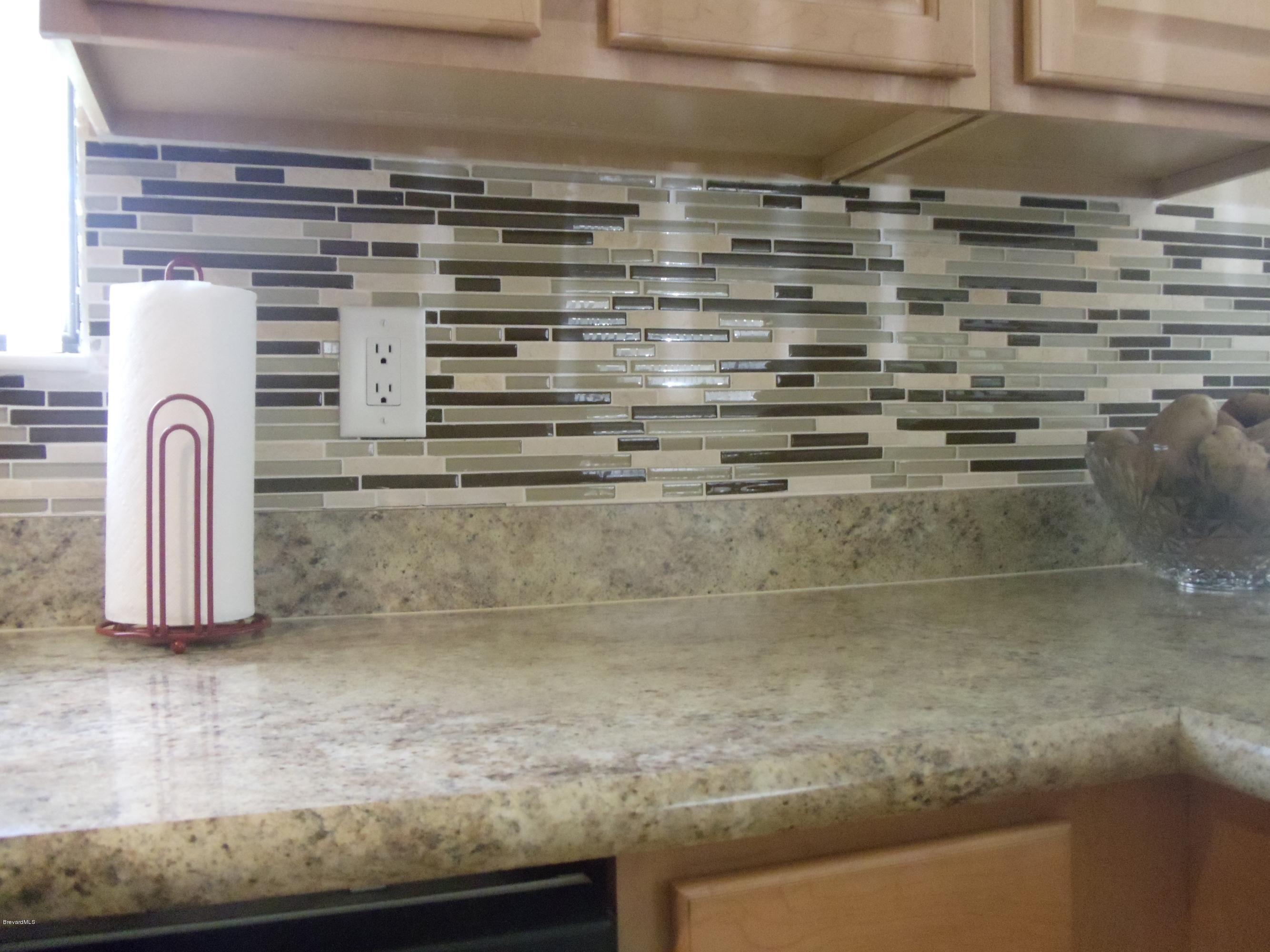 1127 Dorchester Road Palm Bay, FL 32907 - Photo 3 of 20 Countertops and Glass Tile Back Splash