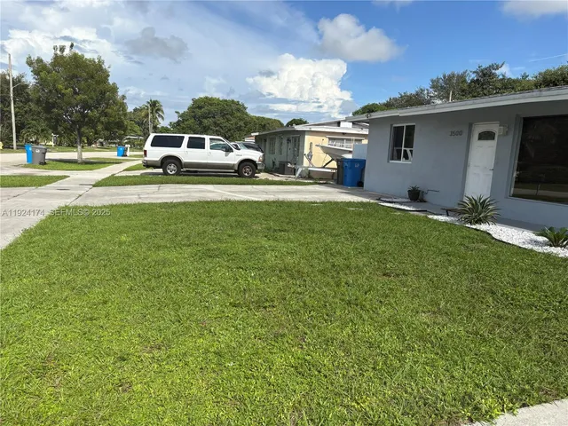 a view of backyard and tree