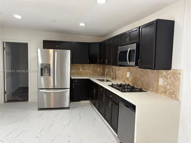 an empty room with closet and mirror