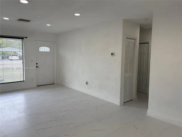 a kitchen with a sink and a stove top oven