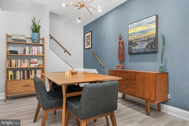 a view of a livingroom with furniture window and wooden floor