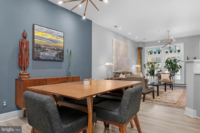 a view of a dining room with furniture and wooden floor