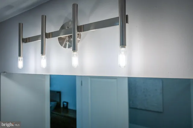 a bathroom with a shower and a sink