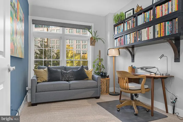 a living room with furniture and a window