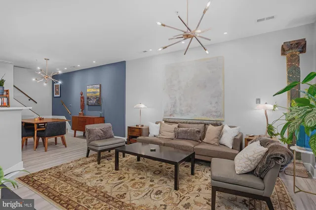 a living room with furniture and a rug