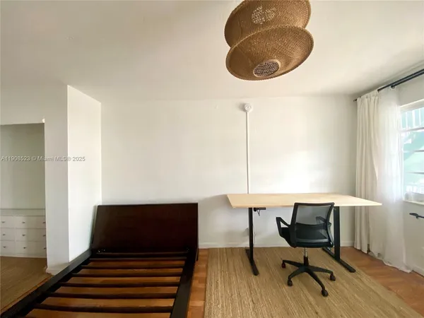 a view of a livingroom with furniture and windows