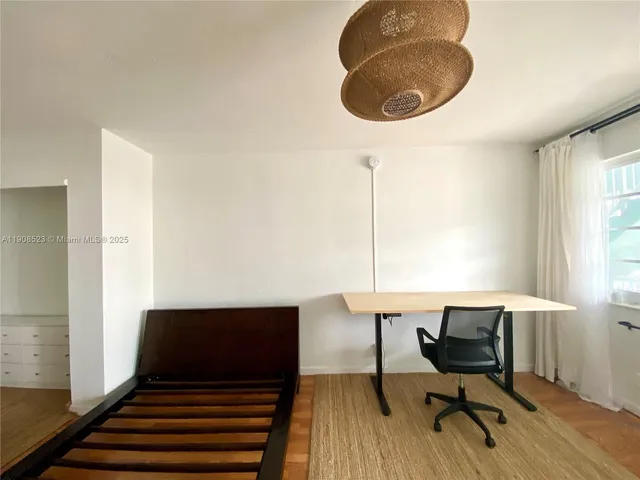 a view of a livingroom with furniture and windows