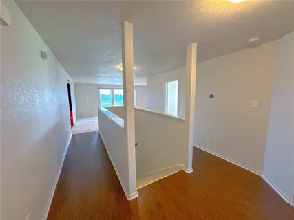 a spacious bathroom with a double vanity sink and a mirror