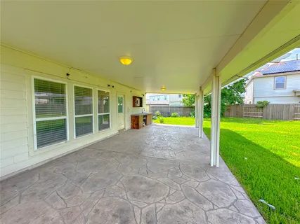 a view of a room with furniture and window