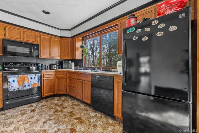 a view of living room and kitchen with furniture