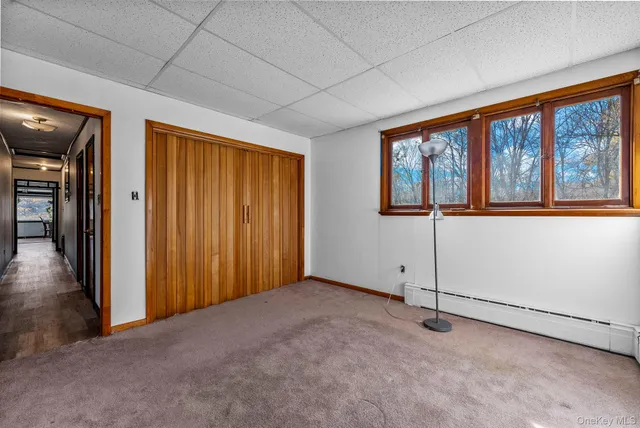 a bedroom with furniture and window