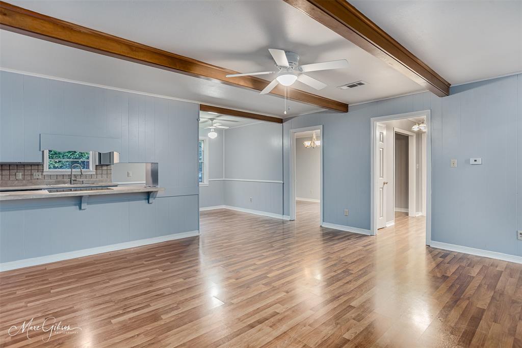 3112 Gorton Road Shreveport, LA 71119 - Photo 12 of 19 a view of kitchen and empty room with wooden floor